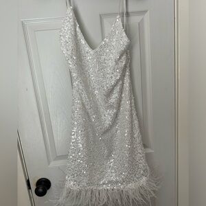Elegant White Sequin Dress with Feather Hem
